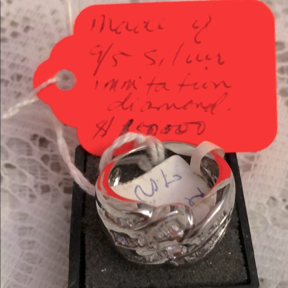 Ring Made of 9/5 Silver; and imitation diamond.